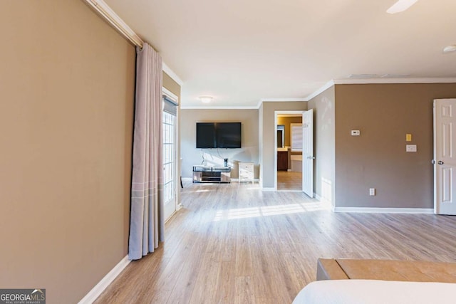 interior space with hardwood / wood-style flooring and ornamental molding