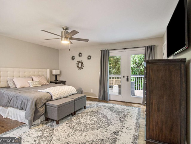 bedroom with hardwood / wood-style floors, access to outside, french doors, and ceiling fan