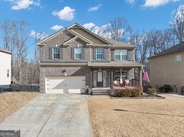 craftsman house with an attached garage, a porch, concrete driveway, and brick siding