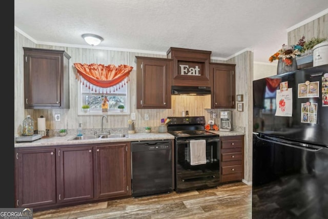 kitchen with hardwood / wood-style flooring, crown molding, sink, and black appliances