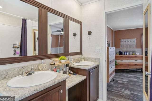 bathroom with ceiling fan, vanity, and hardwood / wood-style floors