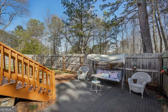 wooden terrace featuring an outdoor living space