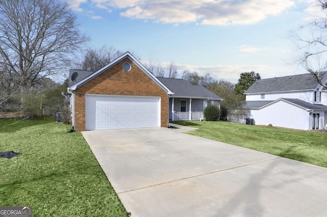 view of front of home with a porch, a garage, and a front lawn