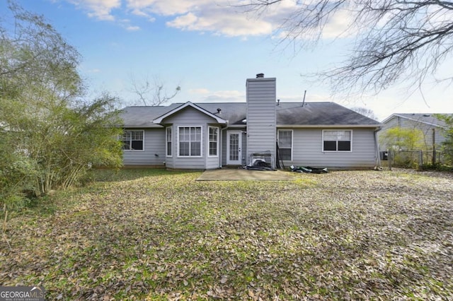 rear view of property featuring a patio area