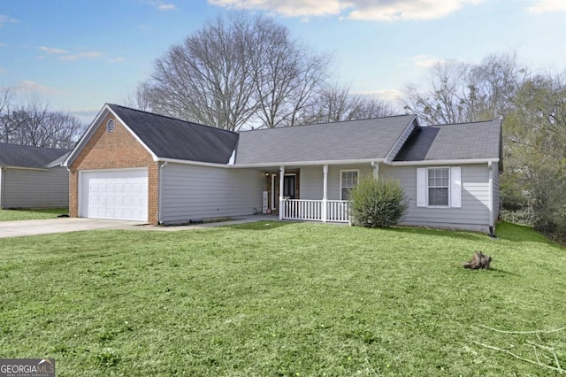 single story home with a garage, a front yard, and covered porch