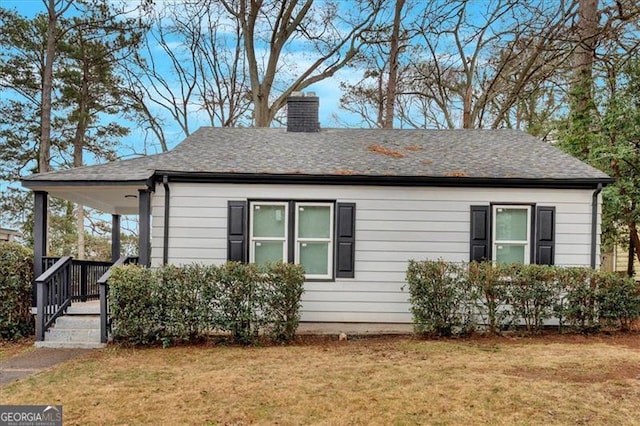 view of side of property featuring a yard