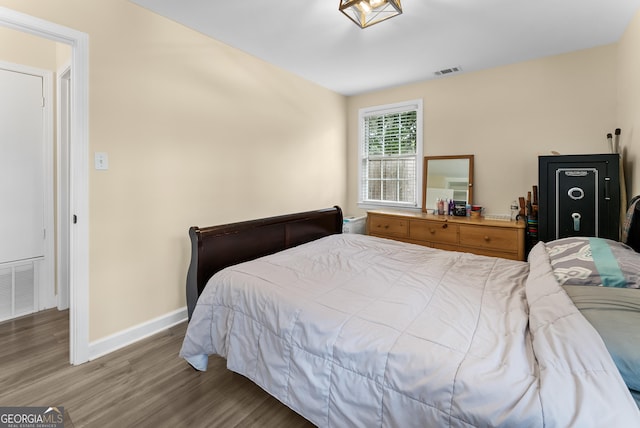 bedroom with wood-type flooring