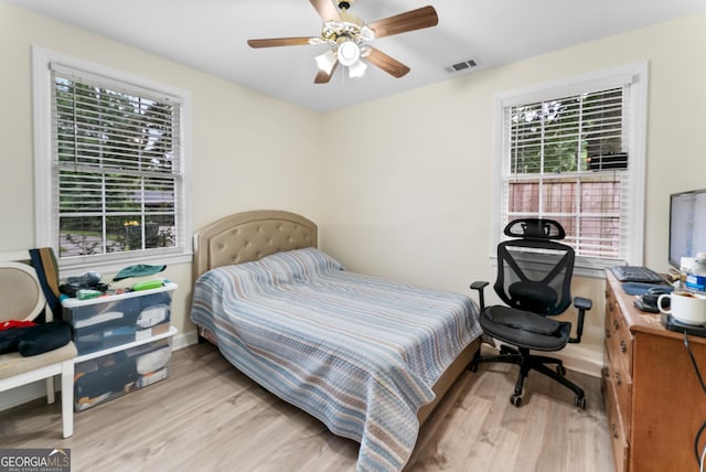 bedroom featuring ceiling fan and light wood-type flooring