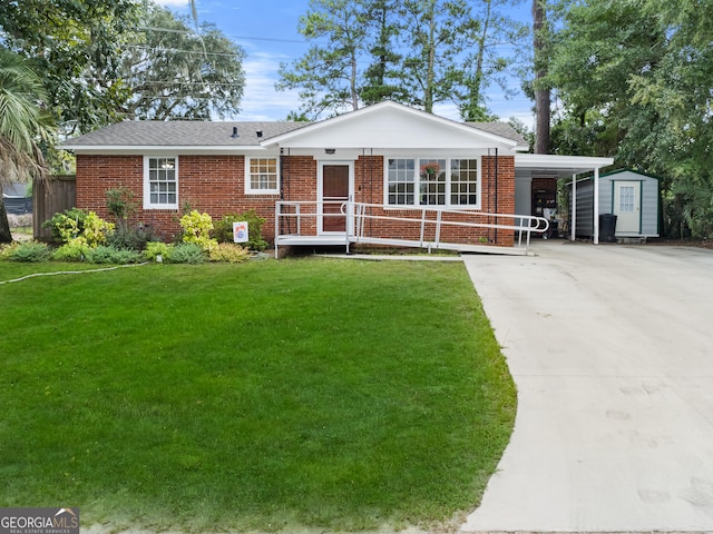 ranch-style home with a carport, a storage unit, and a front lawn