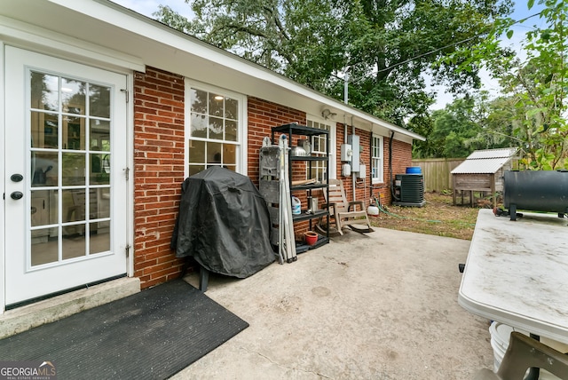 view of patio / terrace with area for grilling and cooling unit