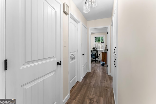 hall with dark hardwood / wood-style floors