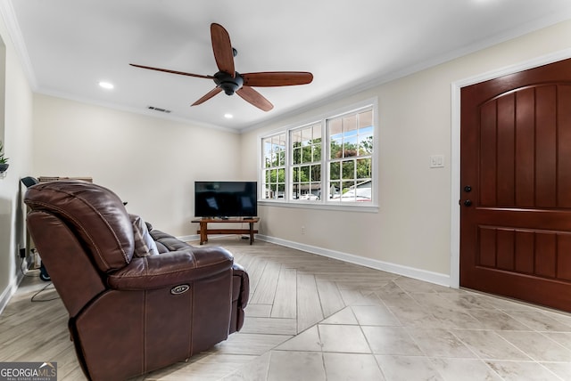 living room featuring ceiling fan and ornamental molding