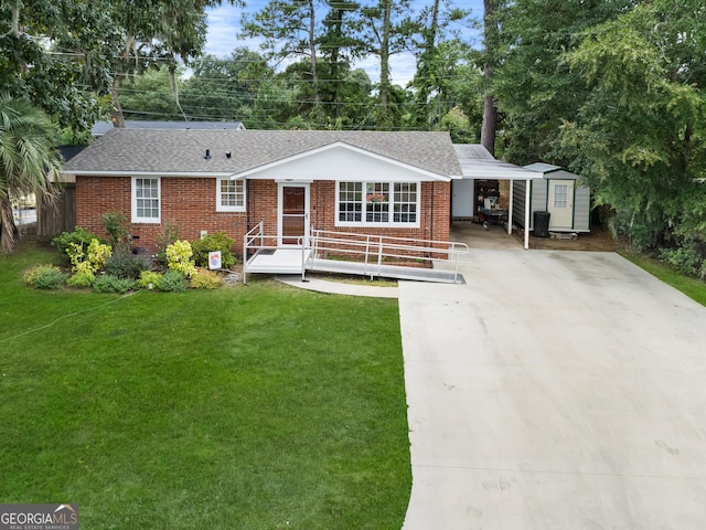 ranch-style house with a front lawn, a carport, and a storage unit