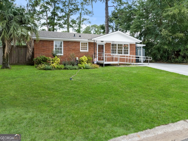 ranch-style house featuring a front lawn