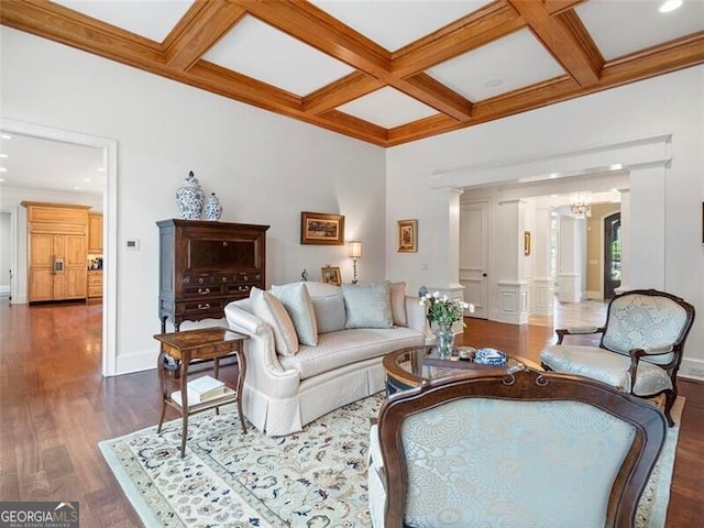 living room with coffered ceiling, dark hardwood / wood-style flooring, beam ceiling, and ornate columns