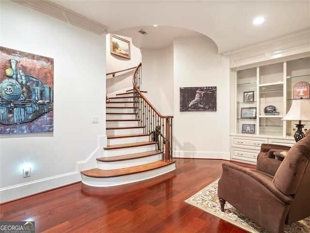 interior space featuring hardwood / wood-style flooring and ornamental molding