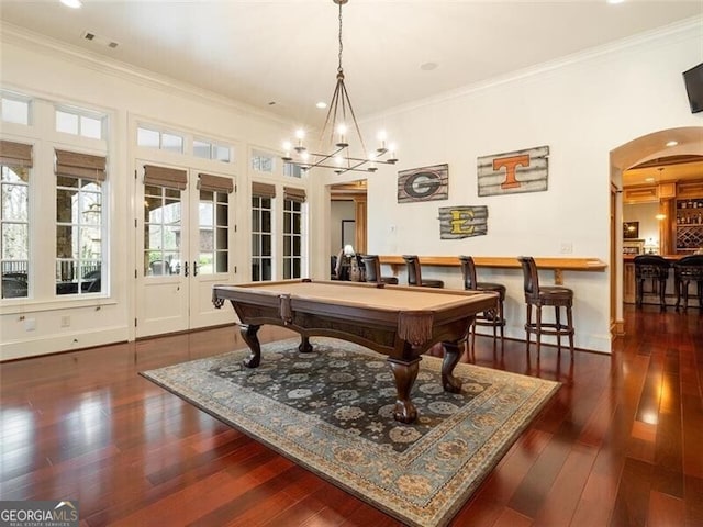 playroom featuring french doors, billiards, ornamental molding, and dark hardwood / wood-style floors