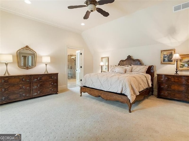 carpeted bedroom featuring vaulted ceiling, ornamental molding, ceiling fan, and ensuite bathroom