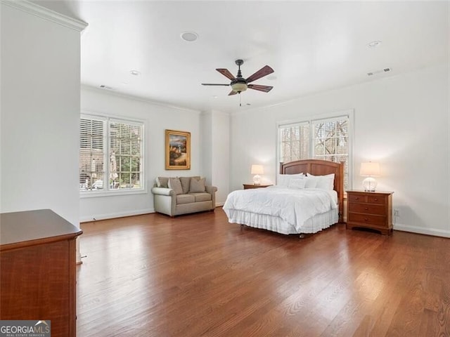 bedroom with ceiling fan and dark hardwood / wood-style floors