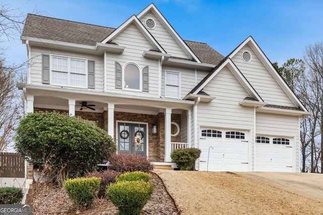 craftsman house with covered porch and a garage