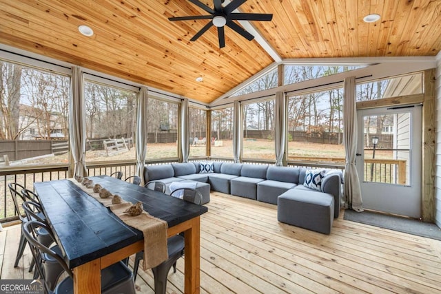 sunroom with vaulted ceiling, ceiling fan, and wood ceiling