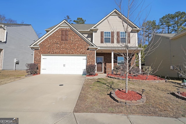 view of front facade with a garage and covered porch