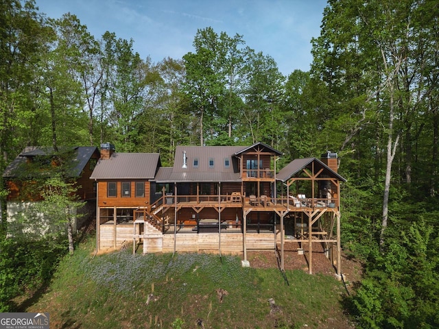 851 Moreland Dr N, Blue Ridge, GA 30513 - rear view of property with a deck, metal roof, a chimney, and stairs
