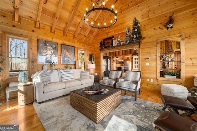 851 Moreland Dr N, Blue Ridge, GA 30513 - living room featuring wooden walls, a wealth of natural light, and hardwood / wood-style flooring