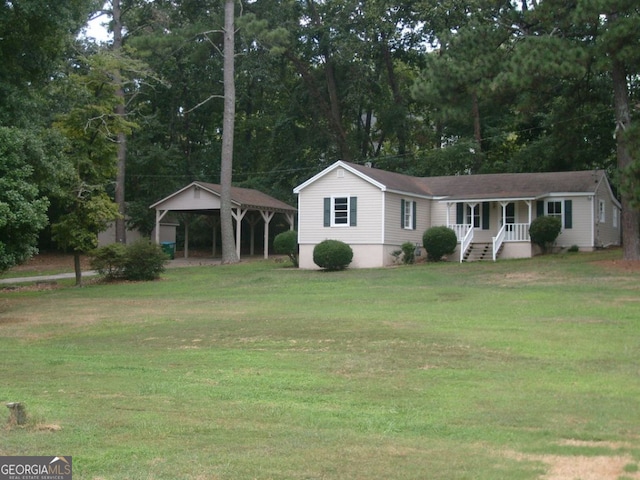 ranch-style house with a carport and a front yard