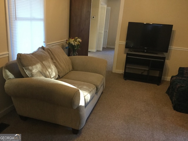 living room featuring light colored carpet