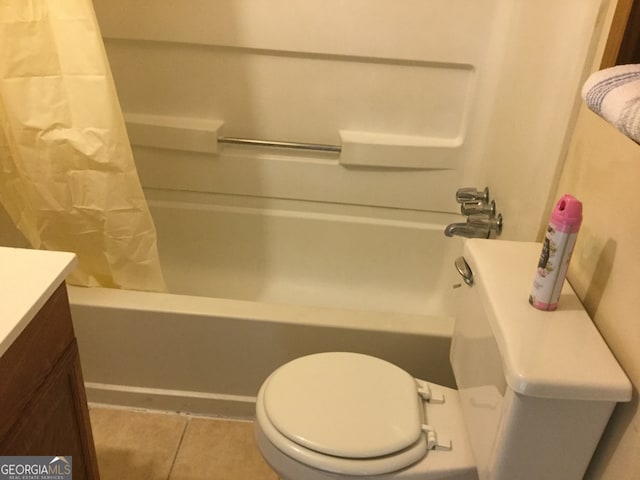 bathroom featuring shower / bath combination with curtain, tile patterned floors, and toilet