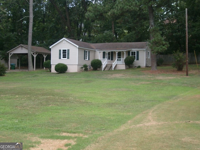 ranch-style home with a front yard and a carport