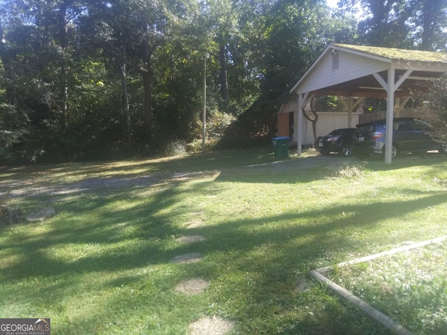 view of yard with a carport