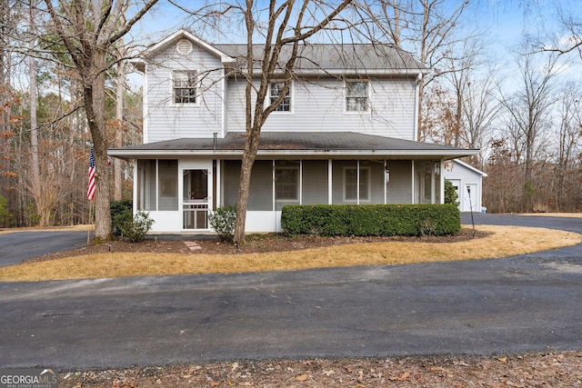 view of front of home featuring a garage and a porch