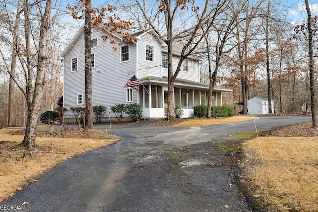 front facade featuring a sunroom