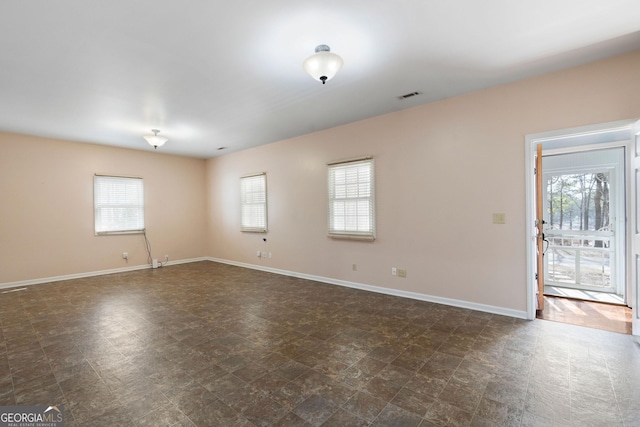 spare room featuring a wealth of natural light