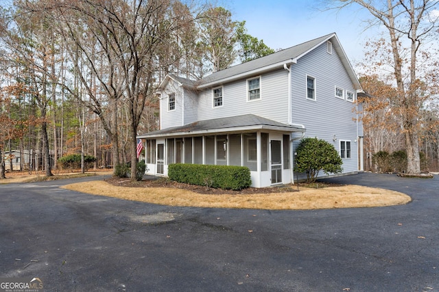 view of front of property with a sunroom