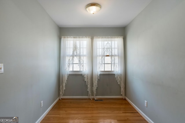 unfurnished room featuring light wood-type flooring