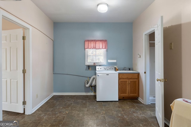 laundry room with sink, washer / dryer, and cabinets