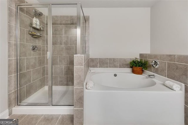 bathroom featuring plus walk in shower