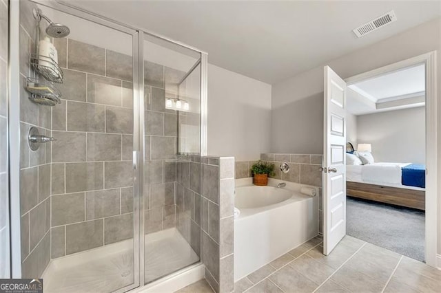 bathroom with tile patterned flooring and plus walk in shower