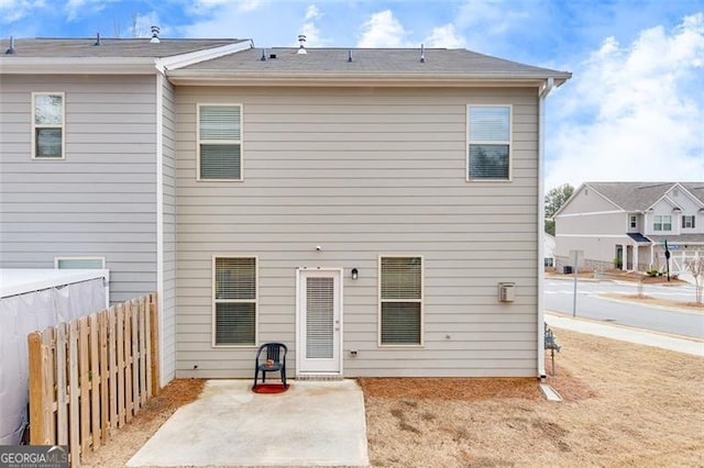 rear view of property featuring a patio