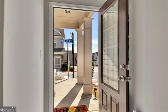 doorway to outside with floor to ceiling windows