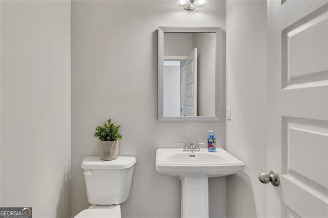 bathroom with sink and toilet