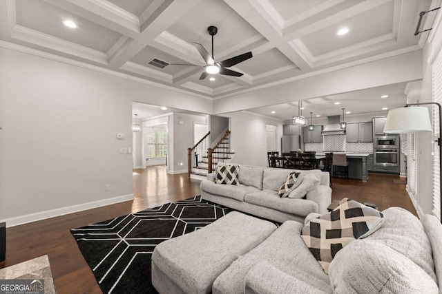 6514 Lemon Grass Ln, Flowery Branch, GA 30542 - living room with stairs, dark wood-style floors, a ceiling fan, beam ceiling, and coffered ceiling