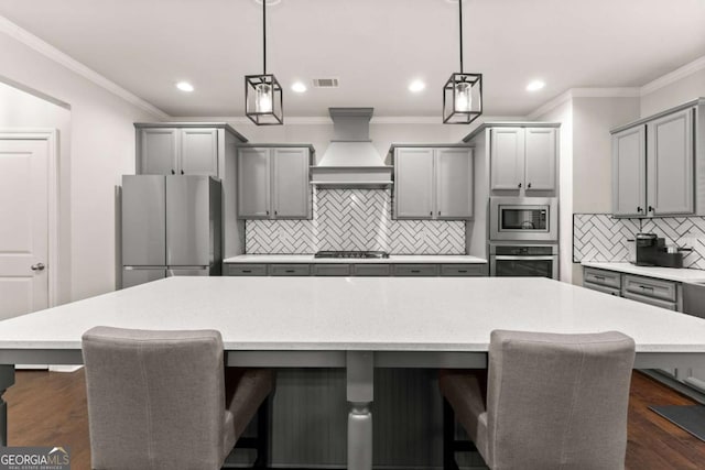 6514 Lemon Grass Ln, Flowery Branch, GA 30542 - kitchen with appliances with stainless steel finishes, gray cabinets, tasteful backsplash, crown molding, and recessed lighting