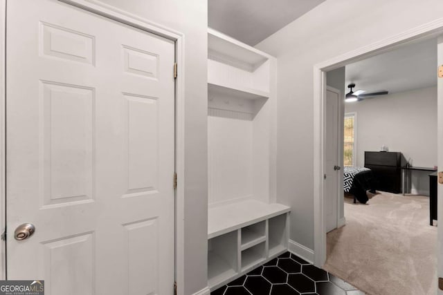 6514 Lemon Grass Ln, Flowery Branch, GA 30542 - mudroom with ceiling fan, dark tile patterned floors, and dark colored carpet