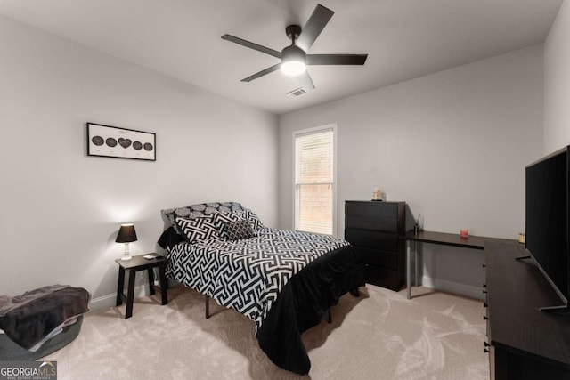 bedroom with light carpet and ceiling fan