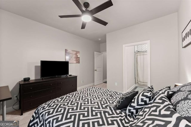 bedroom with light carpet and ceiling fan