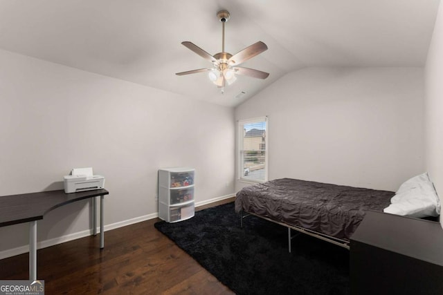 bedroom with vaulted ceiling, dark hardwood / wood-style floors, and ceiling fan